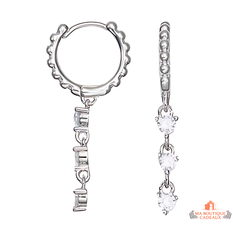 Boucles d'oreilles pendantes en argent 925/°° Carla Nogueres avec trois solitaires en zirconium, garantie 2 ans.