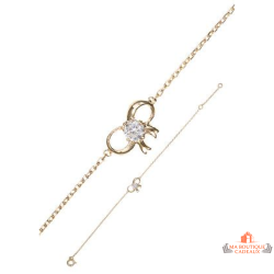 Bracelet Carla Nogueres en plaqué or avec nœud papillon et zirconium. Disponible en 16 ou 18 cm. Élégant et garanti 2 ans.